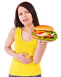 Woman holding hamburger.