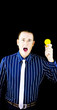 Man with open mouth holding yellow bulb