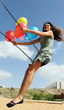 Young woman on a swing