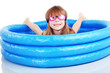 Child playing in swimming pool