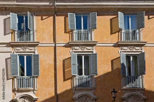 Photo: typical italian facade with windows, rome, italy typical italian facade with windows, rome, italy