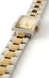 Old woman golden watch placed on the white background.