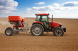 Foto: Small scale farming with tractor and plow in field. Agricultural Small scale farming with tractor and plow in field. Agricultural