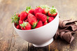Strawberries on brown wooden table Strawberries on brown wooden table