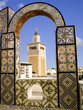 Photo: Mosque minaret framed by a tiled arch in Tunis city, Tunisia Mosque minaret framed by a tiled arch in Tunis city, Tunisia