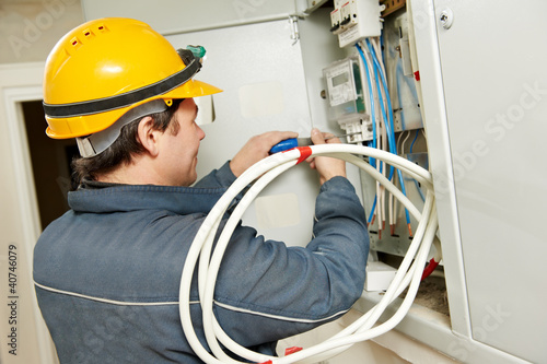 Photo: Electrician installing energy saving meter Electrician installing energy saving meter