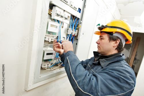 Photo: Electrician installing energy saving meter Electrician installing energy saving meter