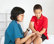 Young Boy with Injury at Doctor's Office Examination