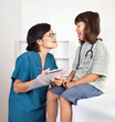 Cute Little Girl with Doctor or Nurse for Examination