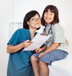 Happy Girl Patient with Friendly Female Doctor or Nurse