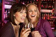 Photo: Two Women Enjoying Drink Together In Bar Two Women Enjoying Drink Together In Bar