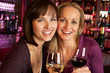 Photo: Two Women Enjoying Drink Together In Bar Two Women Enjoying Drink Together In Bar