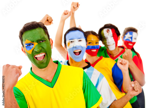 Photo: Latinamerican team with arms up Latinamerican team with arms up