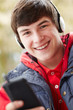 canvas print picture - Teenage Boy Wearing Headphones And Listening To Music Wearing Wi