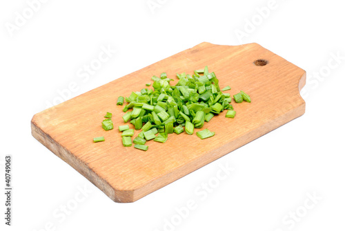 Photo: fresh sliced onions on cutting board isolated on white fresh sliced onions on cutting board isolated on white