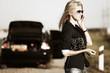 Woman with broken car