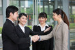 Business people shaking hands.