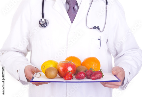 Photo: doctor gives fresh fruit doctor gives fresh fruit
