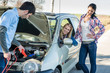 Starter cables man helping two women