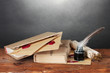 old books, scrolls, feather pen and inkwell old books, scrolls, feather pen and inkwell