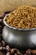 Fresh aromatic coffee beans in a metal red coffee box
