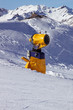 Snow cannon on the mountains background