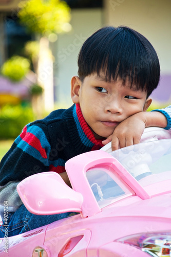 Photo: Asian kid playing in Playground Asian kid playing in Playground