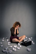 Young desperate girl writing with an old typewriter. Conceptual