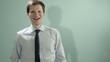 Mid adult businessman arriving late, smiling at camera