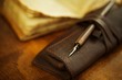 Quill pen near a vintage book.