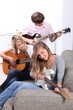 portrait of teenagers playing the guitar