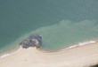 Aerial view of rocky deposits on beach