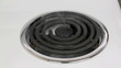Cooking oil burning off on a stove hot plate. Cooking oil burning off on a stove hot plate.