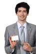 Businessman pointing at blank card