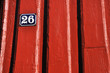 Detail of red timberhouse in Norway with number 26