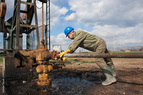 Photo: Oil company worker on the well Oil company worker on the well