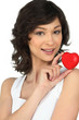 Brunette holding a red foam heart