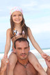 canvas print picture - Dad carries daughter on his shoulders