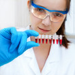Young scientist holds DNA samples
