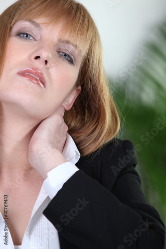 Photo: woman with cervical pain woman with cervical pain