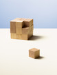 Piece of wooden cube separate from whole