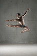 Ballet dancer posing in mid air