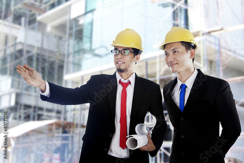 Photo: Asian businessmen at construction site Asian businessmen at construction site