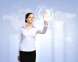 Photo: Business woman and touchscreen technology Business woman and touchscreen technology