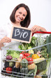 Woman with a trolley of organic vegetables