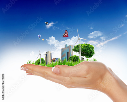Illustrazione: Human hand holding a green landscape Human hand holding a green landscape