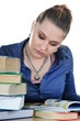 Student girl reads a book at the table