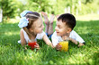 Photo: Little brother and sister in summer park Little brother and sister in summer park