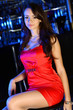 Attractive woman in night club with a drink