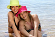 Two woman sitting in the sea